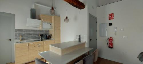 a kitchen with a sink and a counter top at LA CASITA in Hervás