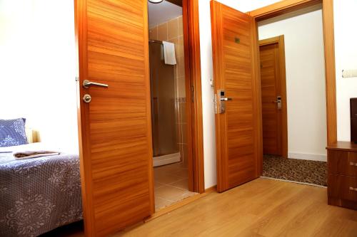 a room with a door open to a bedroom at Miletus Otel Şile in Sile
