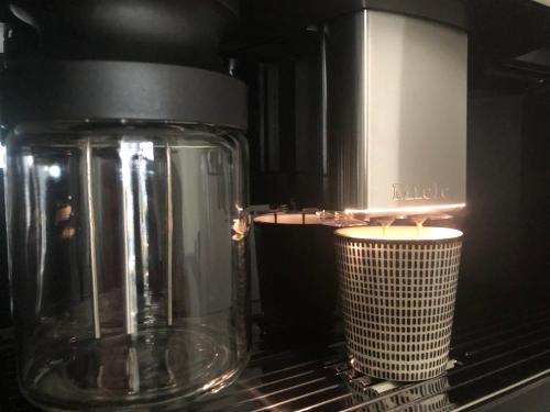 a glass jar sitting on top of a microwave at Appartement Sunny home Deluxe in Knokke-Heist
