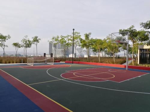 a basketball court in a park with a basketball hoop at Astetica Residences @ Seri Kembangan in Seri Kembangan