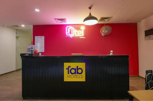 a sign that says jobhats on a red wall at FabExpress Chattarpur Enclave - Opposite Tivoli Garden in New Delhi