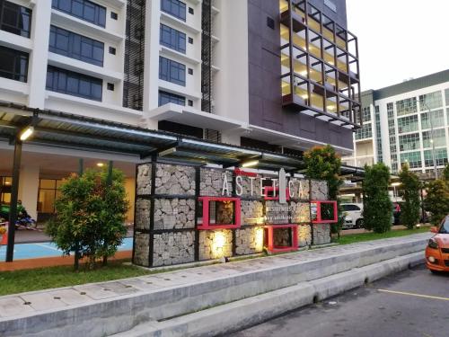 a building with a sign on the side of it at Astetica Residences @ Seri Kembangan in Seri Kembangan