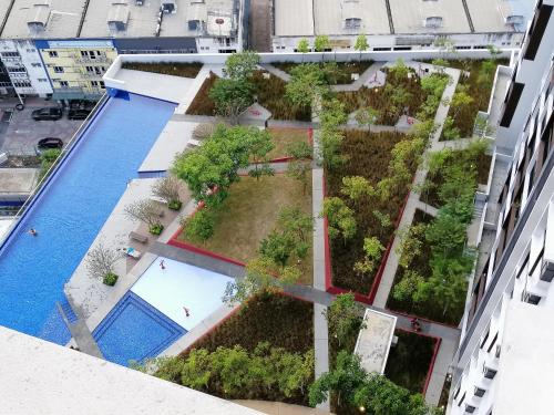 an overhead view of a building with a garden at Astetica Residences @ Seri Kembangan in Seri Kembangan
