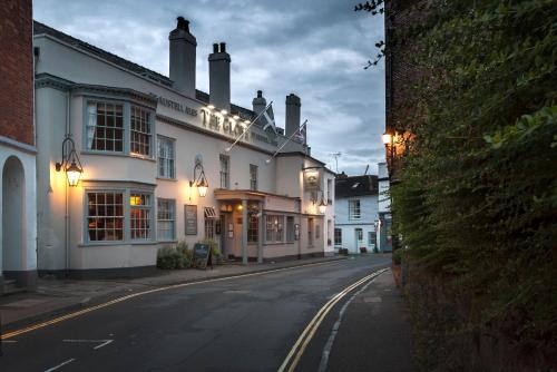 a street with a building with lights on it at The Globe in Exeter