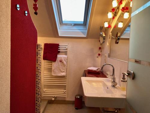 a bathroom with a sink and a window at Gästehaus Huber in Arbesbach