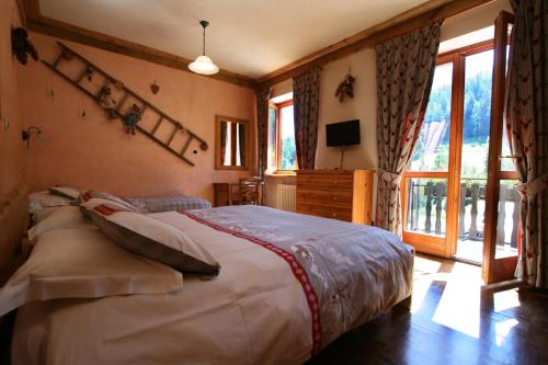 Postel nebo postele na pokoji v ubytování Hotel Tivet