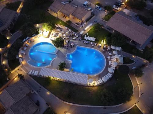 an overhead view of a pool at night at Kikki Village in Modica
