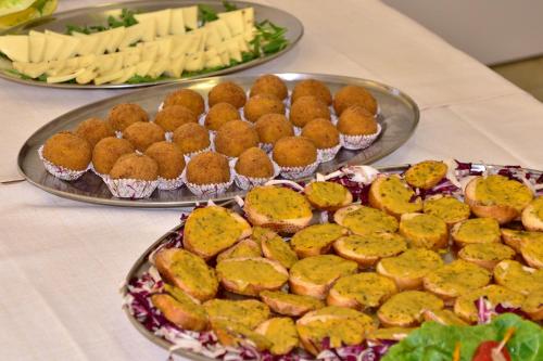 a table topped with two plates of food with muffins at Kikki Village in Modica