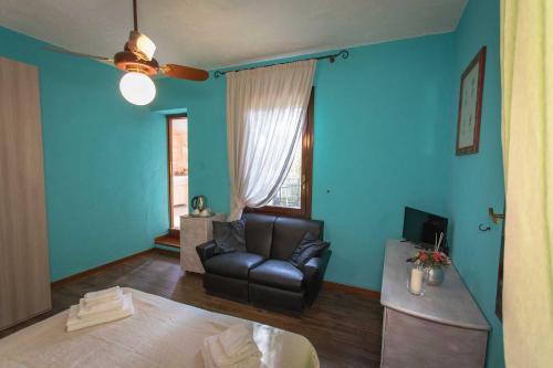 a living room with a couch and a chair at La Tagliolina in Monteveglio