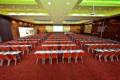 a large room with tables and chairs in it at Holiday Inn Trnava by IHG in Trnava