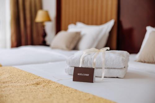 Postel nebo postele na pokoji v ubytování Garni Hotel Planeta Inn