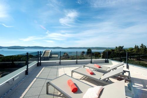 a balcony with a view of the water at Villa Ivan in Sveti Filip i Jakov