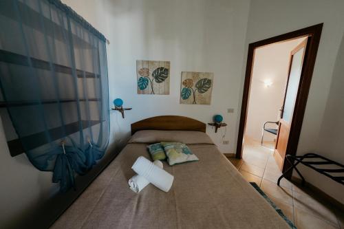 Ένα ή περισσότερα κρεβάτια σε δωμάτιο στο Case Vacanza Cafarella