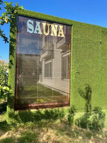 a building with a sanchez sign on the side of it at BELKA GOLF RESİDENCE Deluxe apt Poolside BELEK in Belek