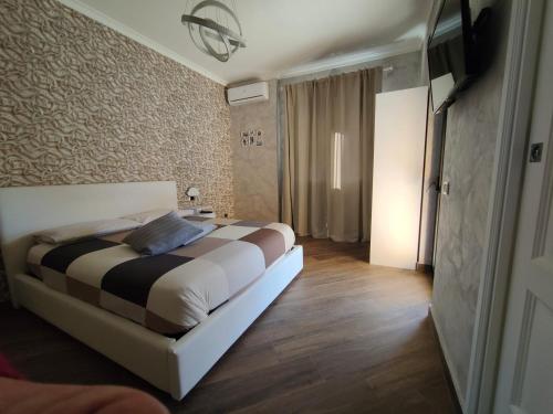 a bedroom with a bed in a room at B&B MaisonAlysie in Foggia