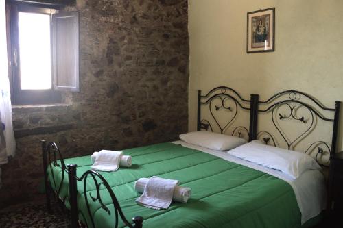 Postel nebo postele na pokoji v ubytování Il Castello