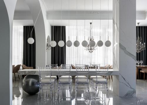 a dining room with a long table and chairs at Бутик-отель 39 by SATEEN GROUP in Rostov on Don