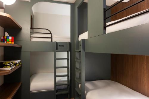 a bunk bed room with two bunk beds at RockyPop Flaine Hotel & Spa in Flaine