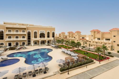 an aerial view of a resort with a swimming pool at Radisson Hotel Riyadh Airport in Riyadh