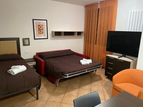 Postel nebo postele na pokoji v ubytování Residence Cimone SuperSci