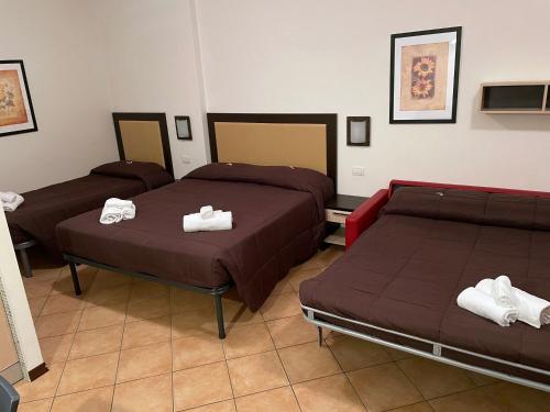 Ліжко або ліжка в номері Residence Cimone SuperSci