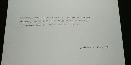 a piece of white paper with a letter on it at B&B Orchidea in Palermo