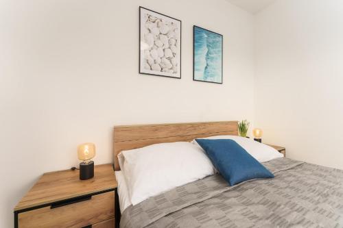 Postel nebo postele na pokoji v ubytování Sunset Resort - Apartament Florencja