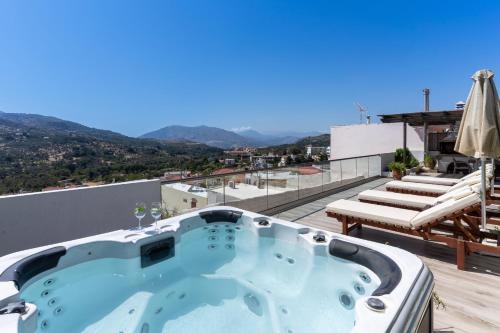 a hot tub on the roof of a house at Casa Sofia, By Hellocrete in Spílion