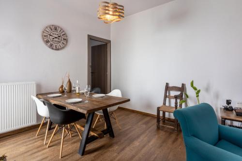 a dining room with a wooden table and chairs at Casa Sofia, By Hellocrete in Spílion