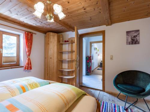 Tempat tidur dalam kamar di Sunnseit Lodge - Kitzbüheler Alpen