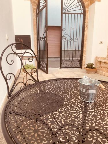 a wrought iron table in front of a gate at Nonna Veronica in Gemini