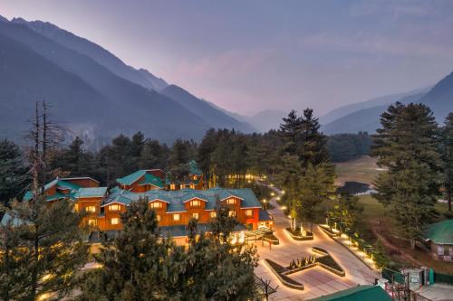 an aerial view of a resort with mountains in the background at Radisson Golf Resort Pahalgam in Pahalgām