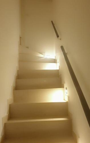 a staircase with a light at the top of it at Apartment mit schöner, moderner Einrichtung in Cologne