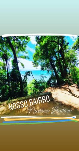 a sign for the nissko barro massage resort at Casa Vista al Mar in Morro de São Paulo