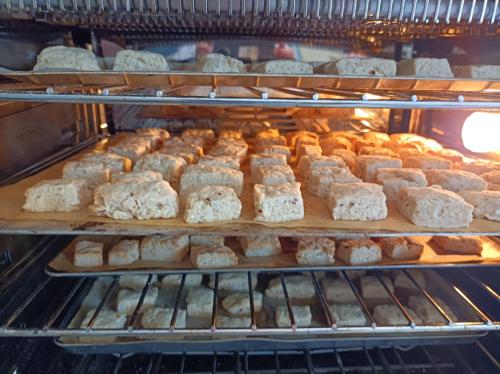 an oven filled with lots of different types of bread at Chambre d'hôtes couvent d'Alando in Alando