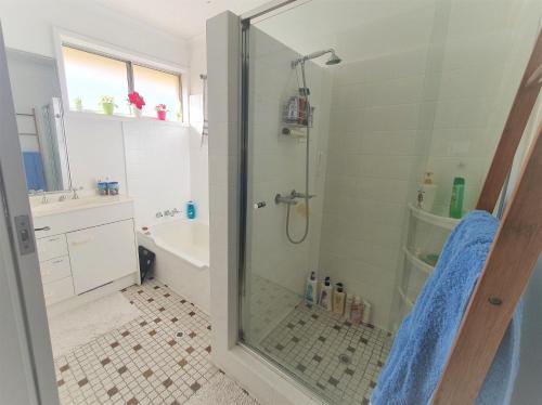 a shower with a glass door in a bathroom at Amazing City Location-Private Room in a Share House-2 Rooms available!! in Brisbane