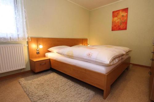 Кровать или кровати в номере Holiday complex Landlust, Mühlental