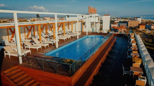 a balcony with a swimming pool on a cruise ship at Hotel DelMarInn All inclusive in Vityazevo