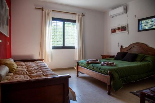 Кровать или кровати в номере Cuesta los Robles -Casas Serranas-
