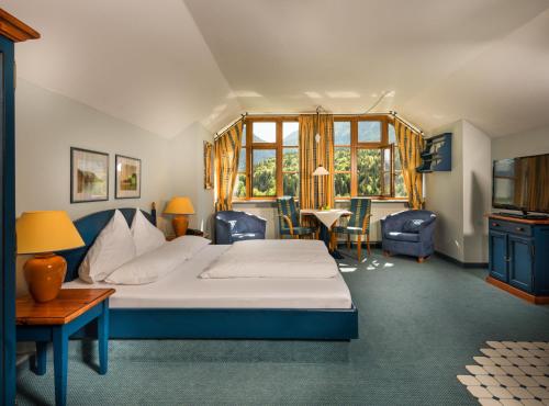 Postel nebo postele na pokoji v ubytování MONDI Appartements am Grundlsee