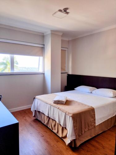 Ένα ή περισσότερα κρεβάτια σε δωμάτιο στο Hotel Itália