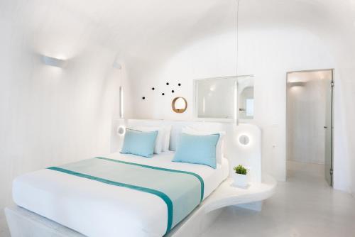 Postel nebo postele na pokoji v ubytování Maregio Suites