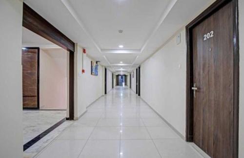 a hallway of an office building with a hallwayngth at Alba Premier, Ahmedabad in Ahmedabad