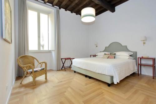 En eller flere senger på et rom på Residenza Torre Vecchiarelli - apt 3