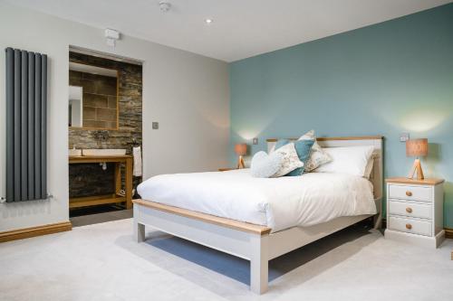 a bedroom with a bed and a fireplace at The Venue Serviced Apartments in Huddersfield