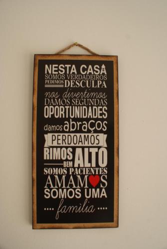 a picture of a sign with words on a wall at Casa do Vale Cabo in Olival