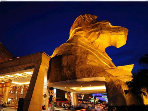 a statue in front of a building at night at Hotel Sunjoy9 Bandar Sunway in Petaling Jaya