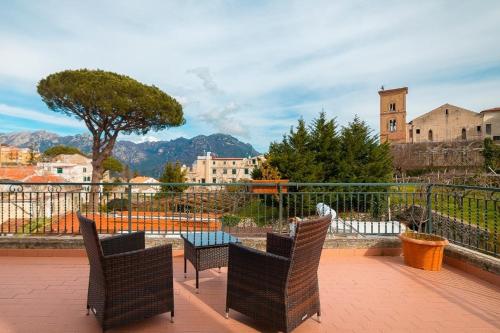 a group of chairs and a table on a patio at Casa Vacanze Vittoria in Ravello
