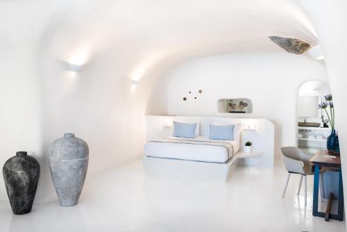 Postel nebo postele na pokoji v ubytování Maregio Suites