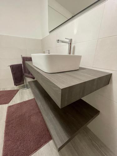 a bathroom with a white sink on a counter at Le Due Terrazze in Brenzone sul Garda